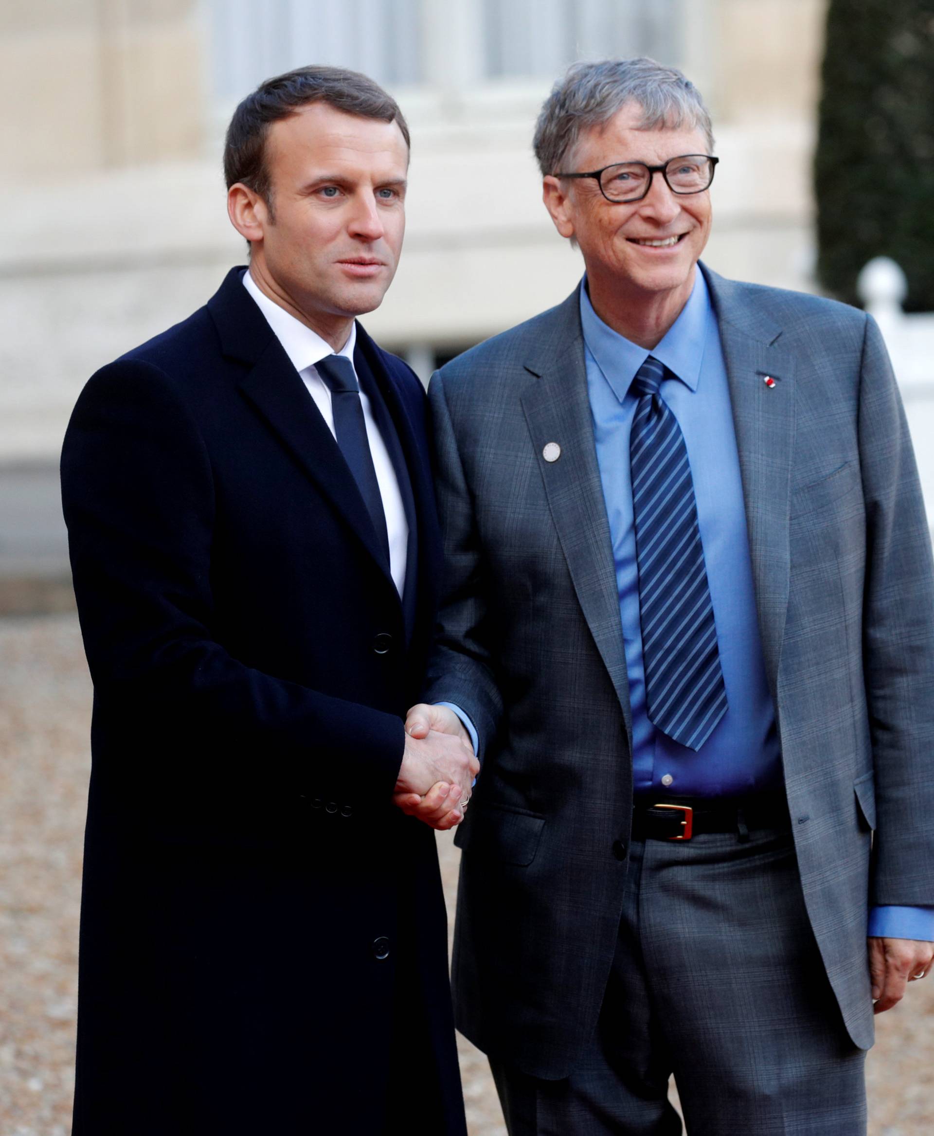 French President Emmanuel Macron welcomes Philanthropist and co-founder of the Microsoft Corporation Bill Gates for a lunch at the Elysee Palace as part of the One Planet Summit in Paris