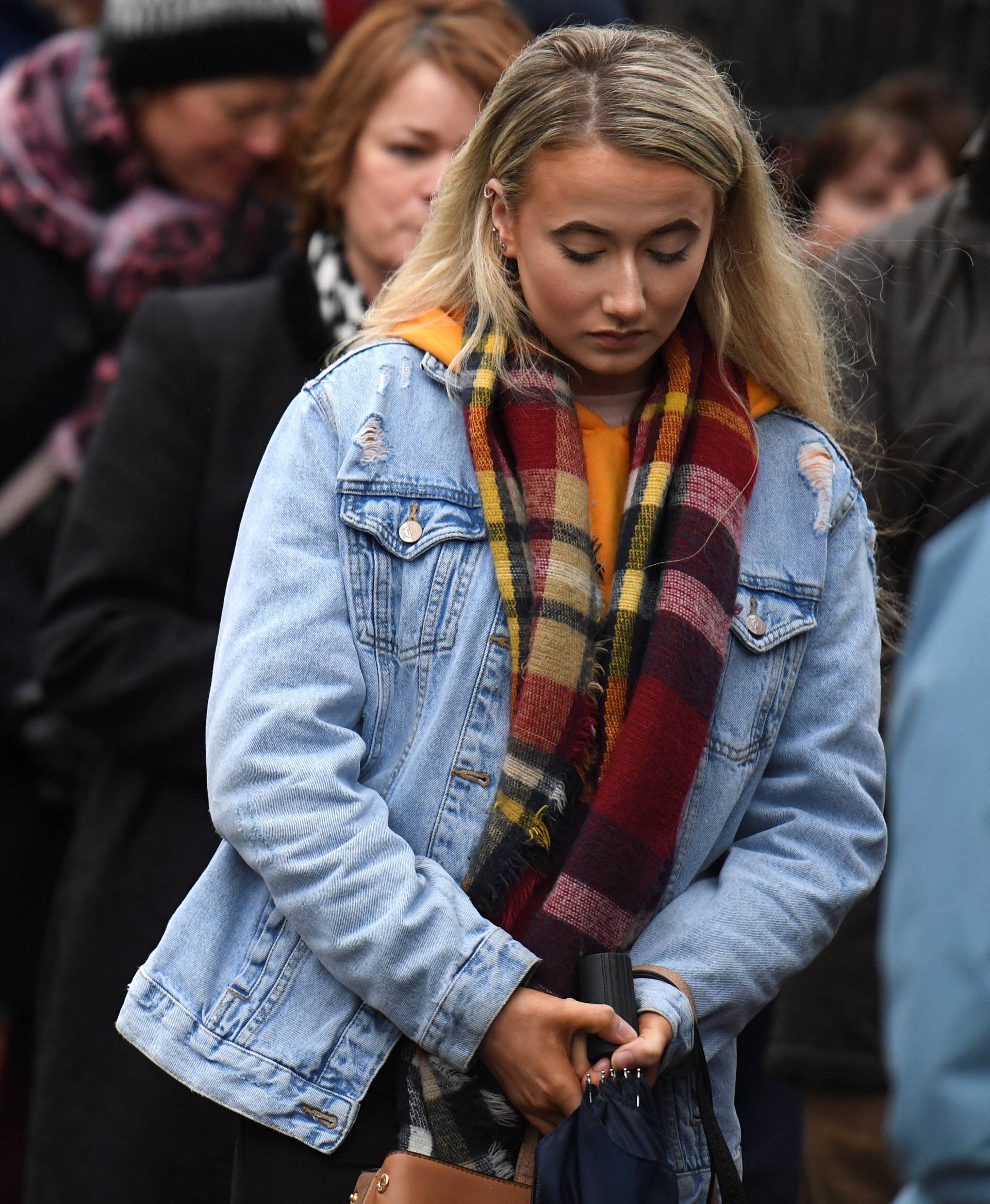 Members of the public queue to see Cranberries singer Dolores O'Riordan's coffin as it is carried into St. Joseph's Church for a public reposal in Limerick