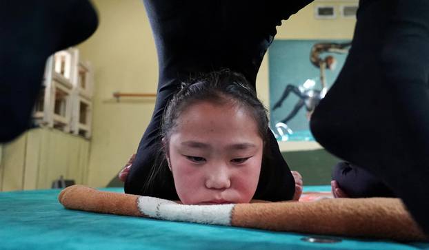 A young contortionist practices at a training school in Ulaanbaatar