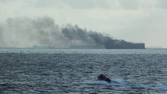 Rescue teams reach oil tankers on fire off the Singaporean island of Pedra Branca