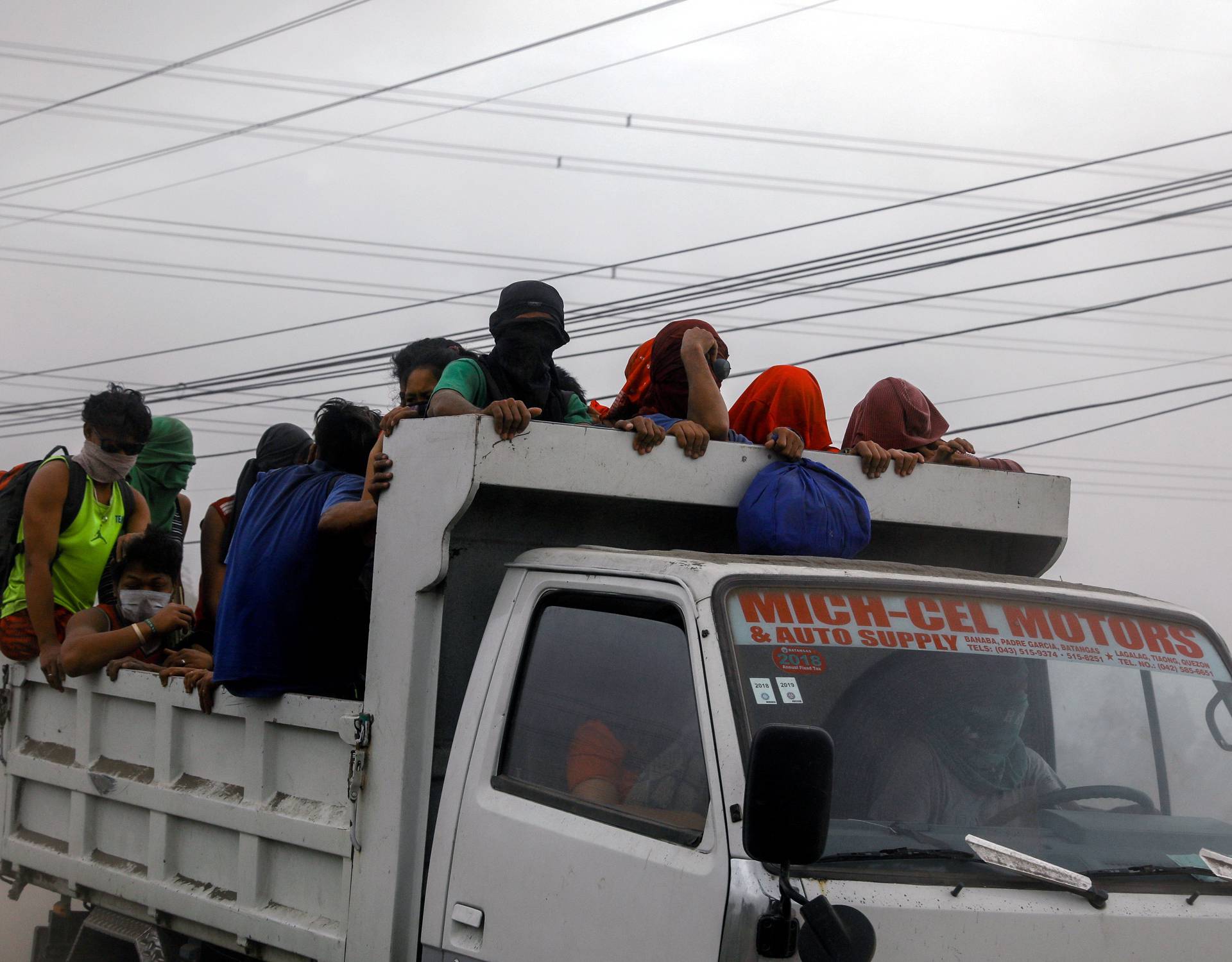 Residents living near the erupting Taal Volcano are evacuated in Agoncillo