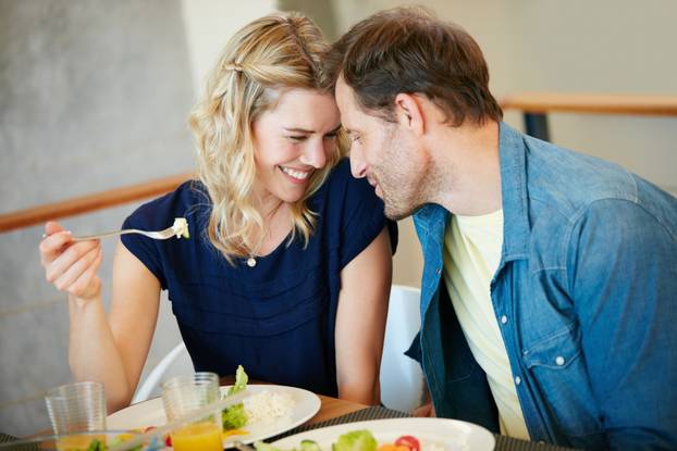 Love makes everything taste ten times better. a couple enjoying a meal together at home.