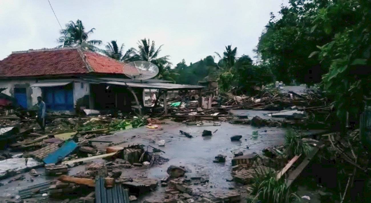 Debris surrounds a house damaged by tsunami at Lampung province