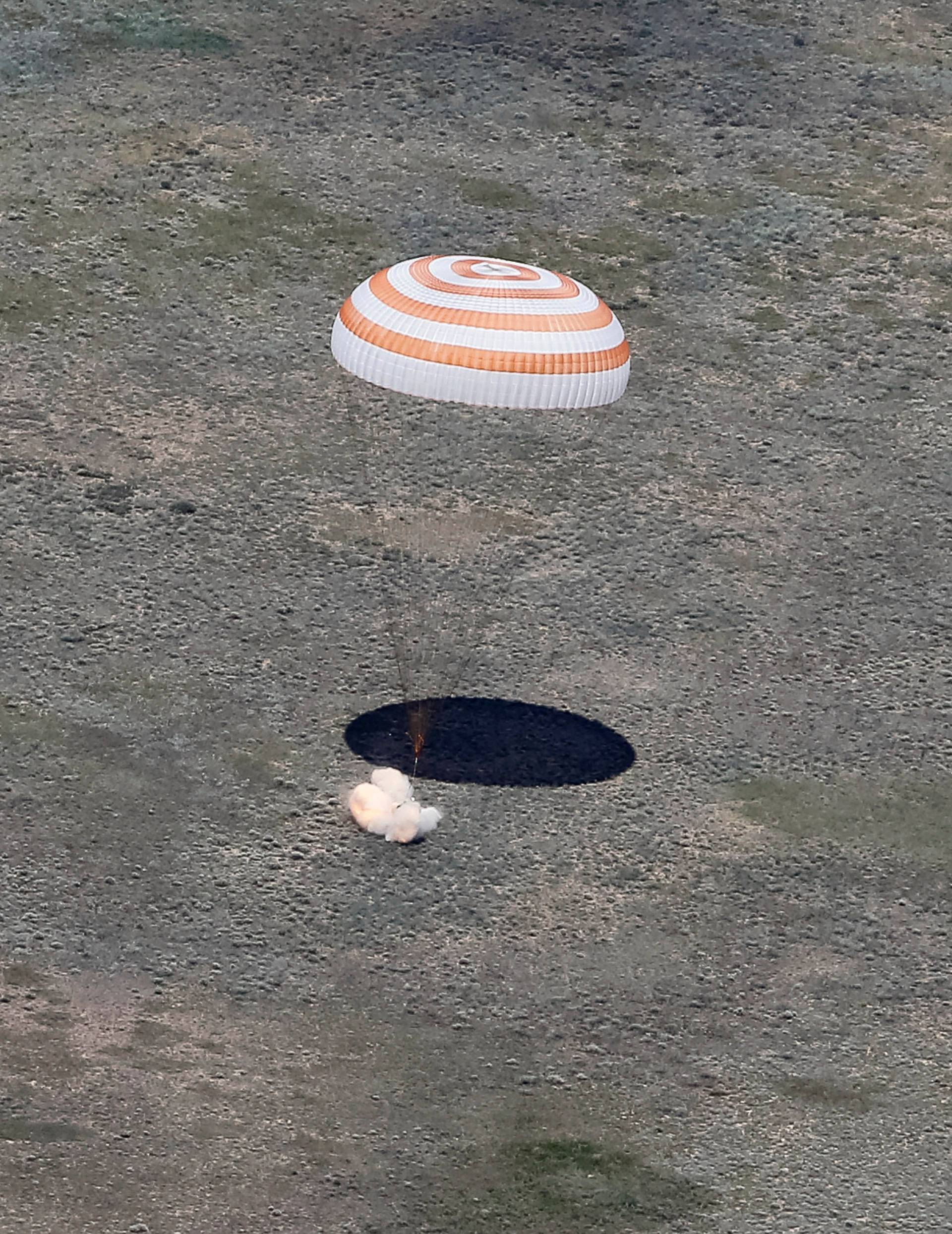 Soyuz TMA-19M spacecraft capsule carrying ISS crew members Peake of Britain, Malenchenko of Russia and Kopra of U.S. lands near Dzhezkazgan