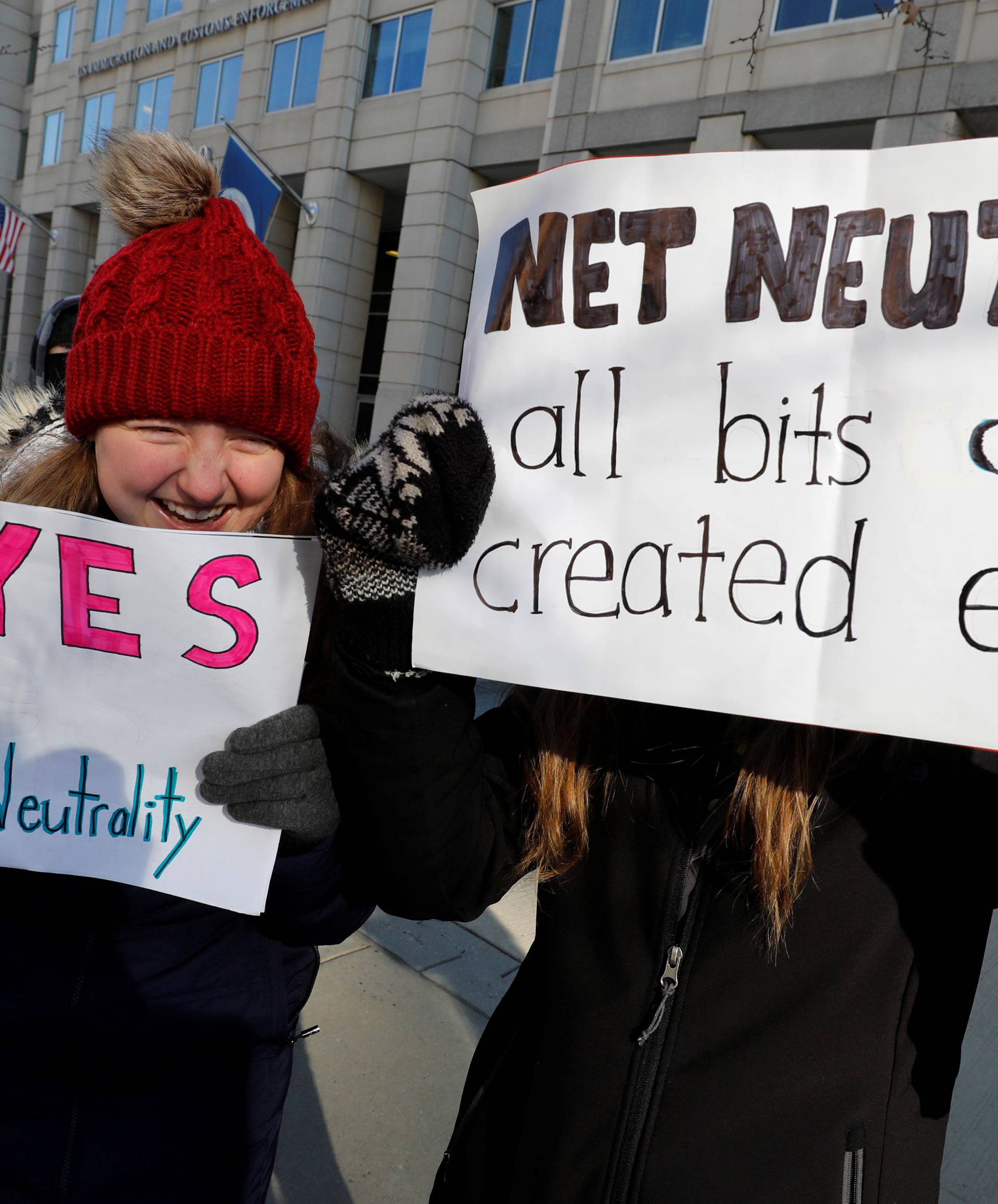 Net neutrality advocates rally in front of the Federal Communications Commission in Washington