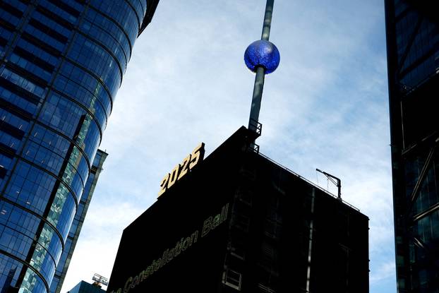 A newly created New Year's eve ball adorned with 5,280 Waterford crystals is raised for the first time above One Times Square ahead of the New Year's Eve ball drop in New York City