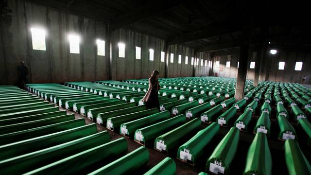 FILE PHOTO: Bosnian Muslim woman searches coffins in Potocari
