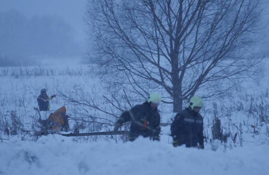 Emergency services work at the scene where a short-haul regional Antonov AN-148 plane crashed after taking off from Moscow's Domodedovo airport, outside Moscow