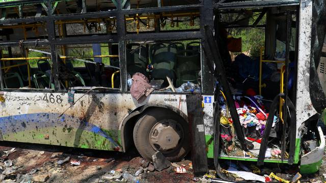 FILE PHOTO: A damaged bus is seen after an explosion at insurgent-held al-Rashideen