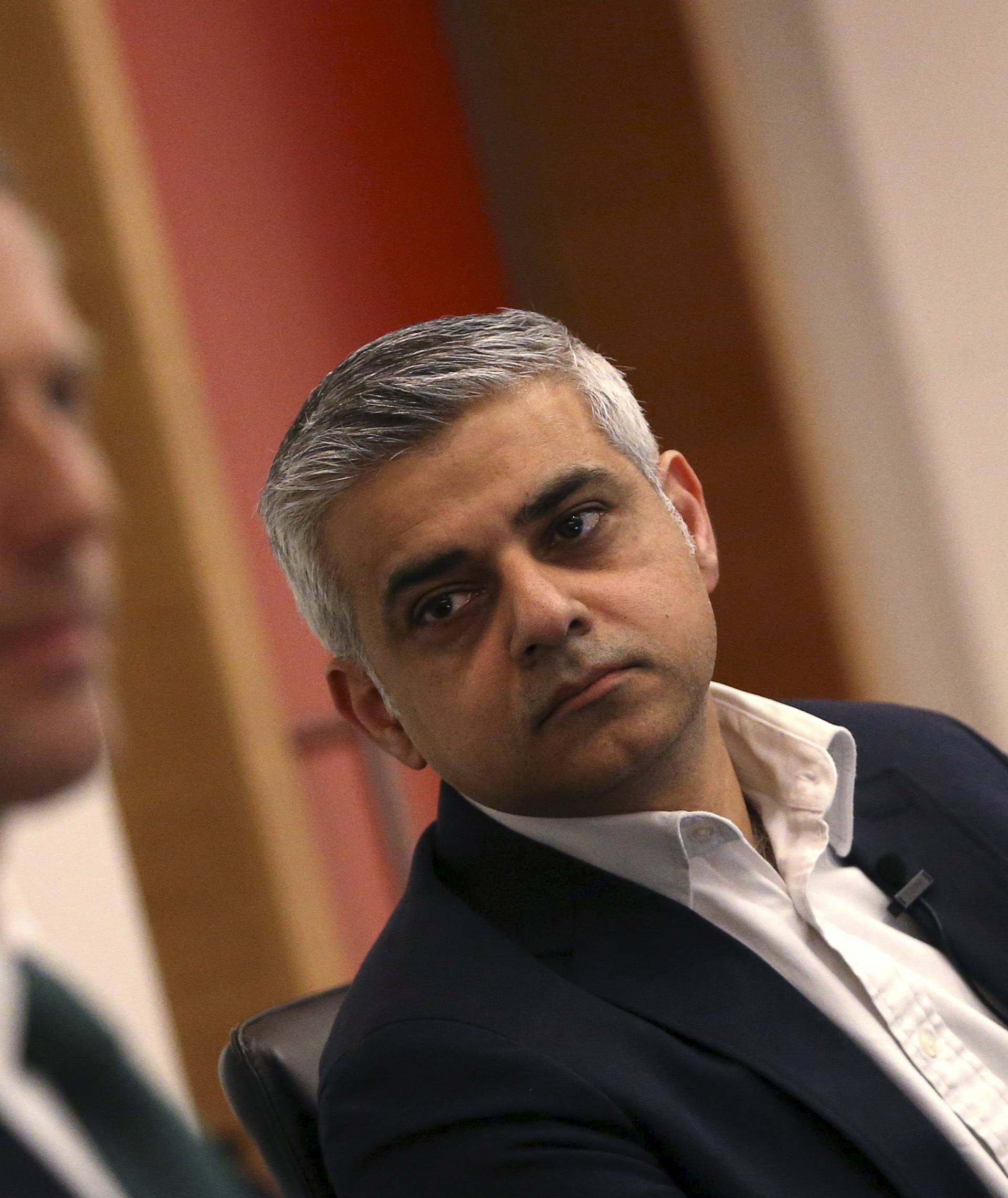 Britain's Labour Party candidate for Mayor of London Sadiq Khan looks at Conservative party candidate Zak Goldsmith during a hustings event in London