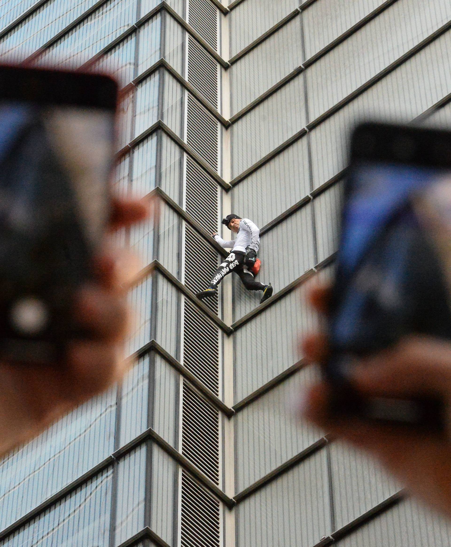 Alain Robert climbs Heron Tower