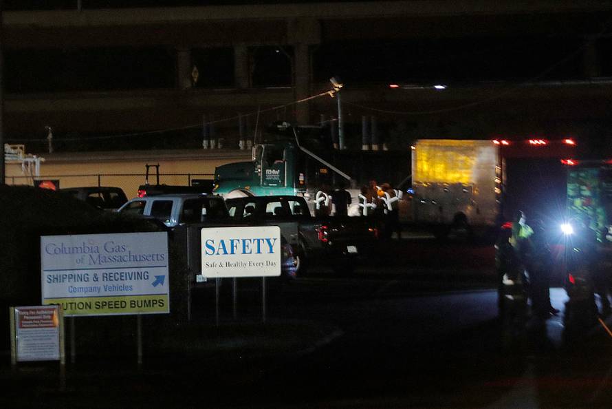 Crew gather at the Columbia Gas of Massachusetts facility after dozens of explosions in Lawrence