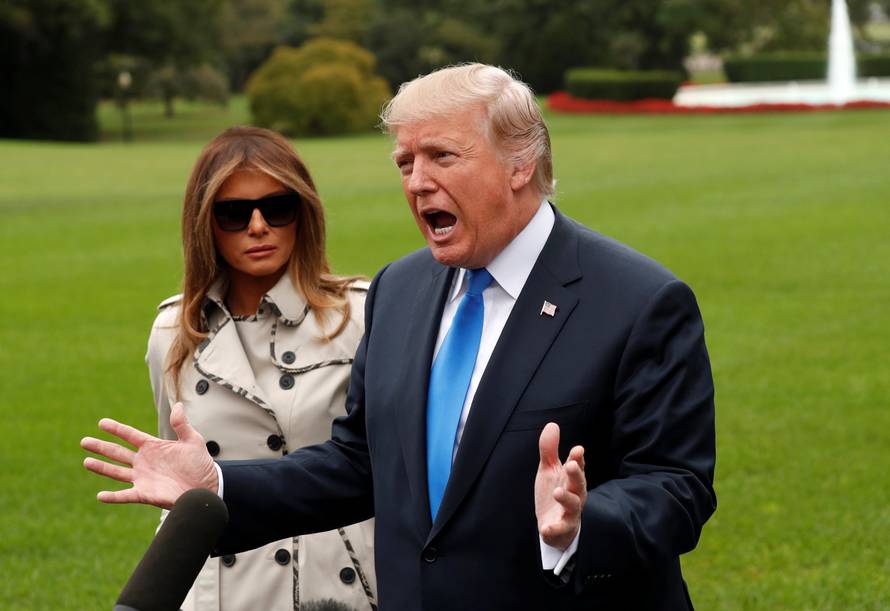 Trump speaks to reporters as he leaves the White House in Washington