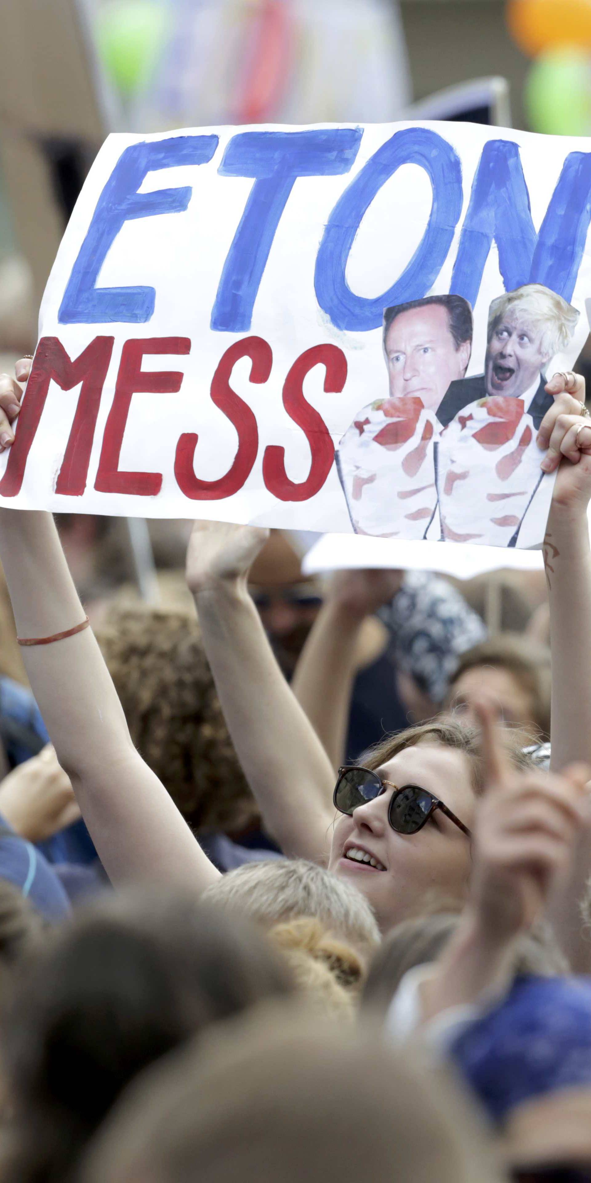 People hold banners during a demonstration against Britain's decision to leave the European Union, in central London