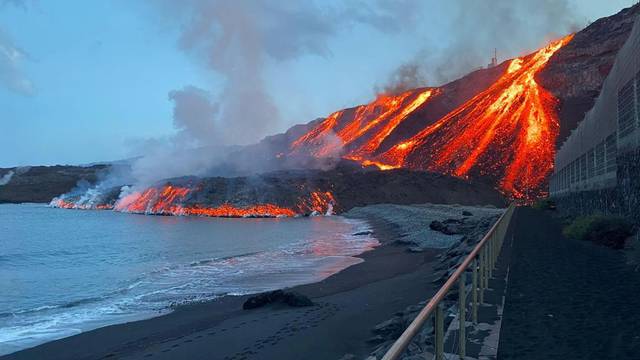 Lava spewed by volcano reaches the Atlantic Ocean at Los Guirres beach