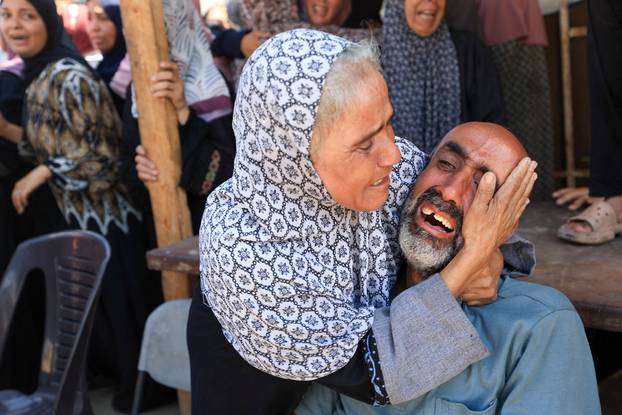 Mourners attend the funeral of Palestinians killed in overnight Israeli airstrikes, in Gaza City