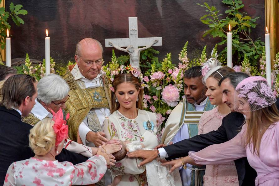Princess Madeleine with Princess Adrienne are seen together during the christening ceremony  in Drottningholm Palace Chapel outside Stockholm