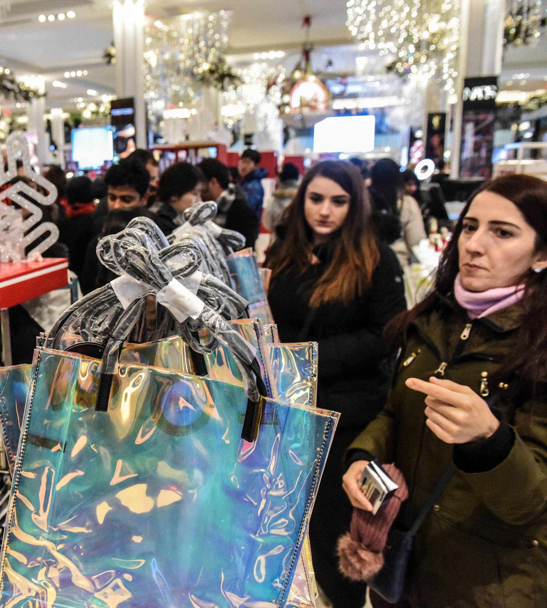 People shop during a Black Friday sales event at Macy's flagship store in New York City