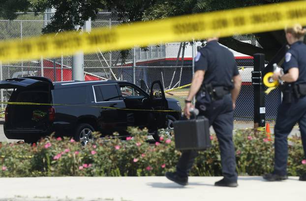 Police investigate shooting scene after a gunman opened fire on Republican members of Congress during a baseball practice near Washington in Alexandria, Virginia