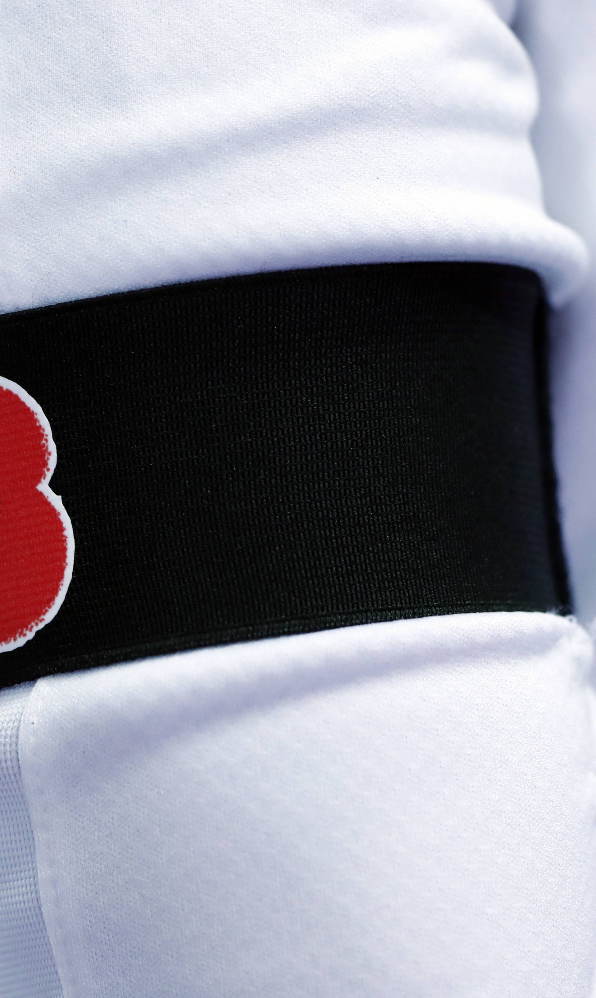 England players wear poppies on armbands as part of remembrance commemorations