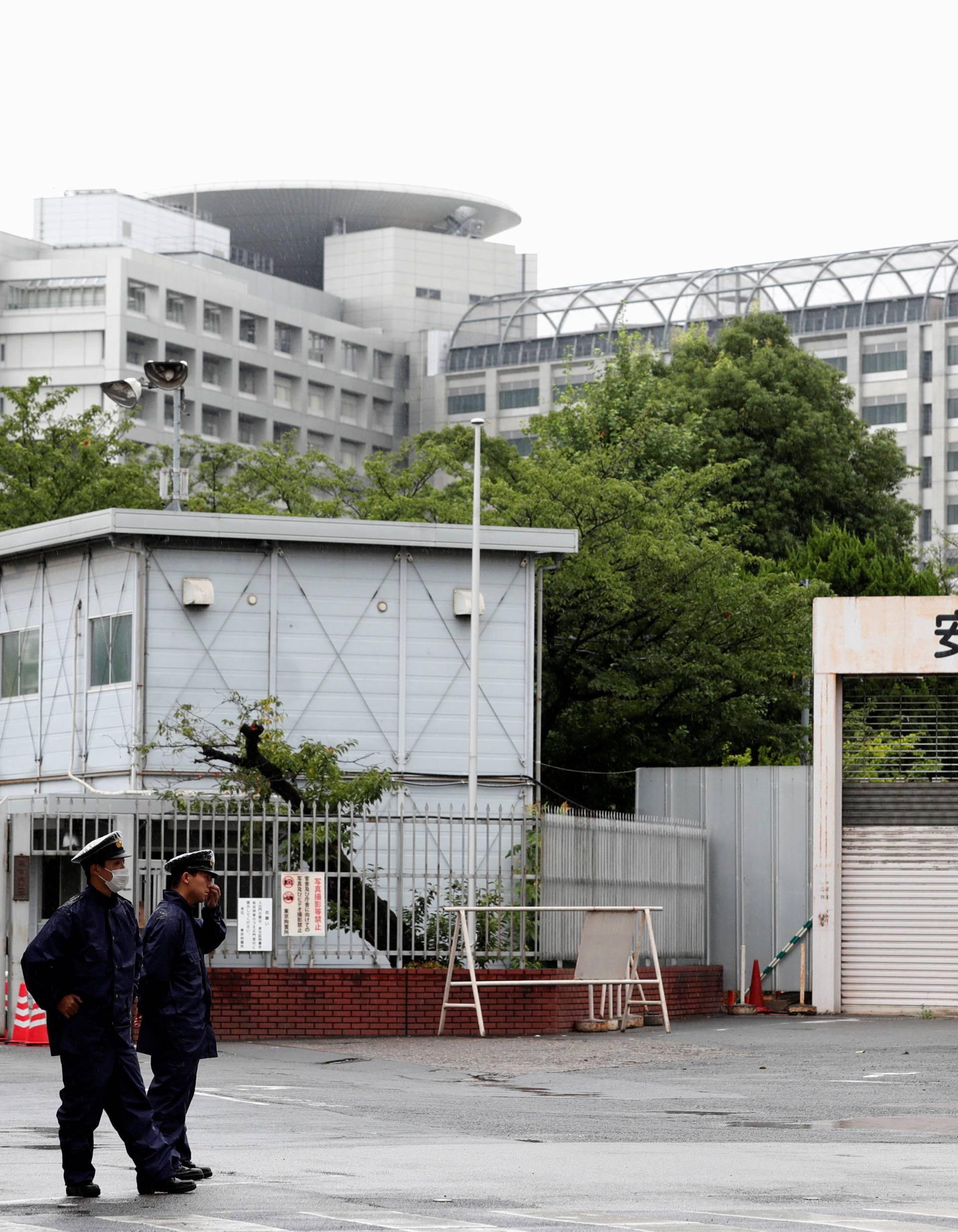 Police officers stand guard in front of Tokyo Detention Center where former leader of Aum, the Japanese doomsday cult, Chizuo Matsumoto, who went by the name Shoko Asahara, was executed, in Tokyo