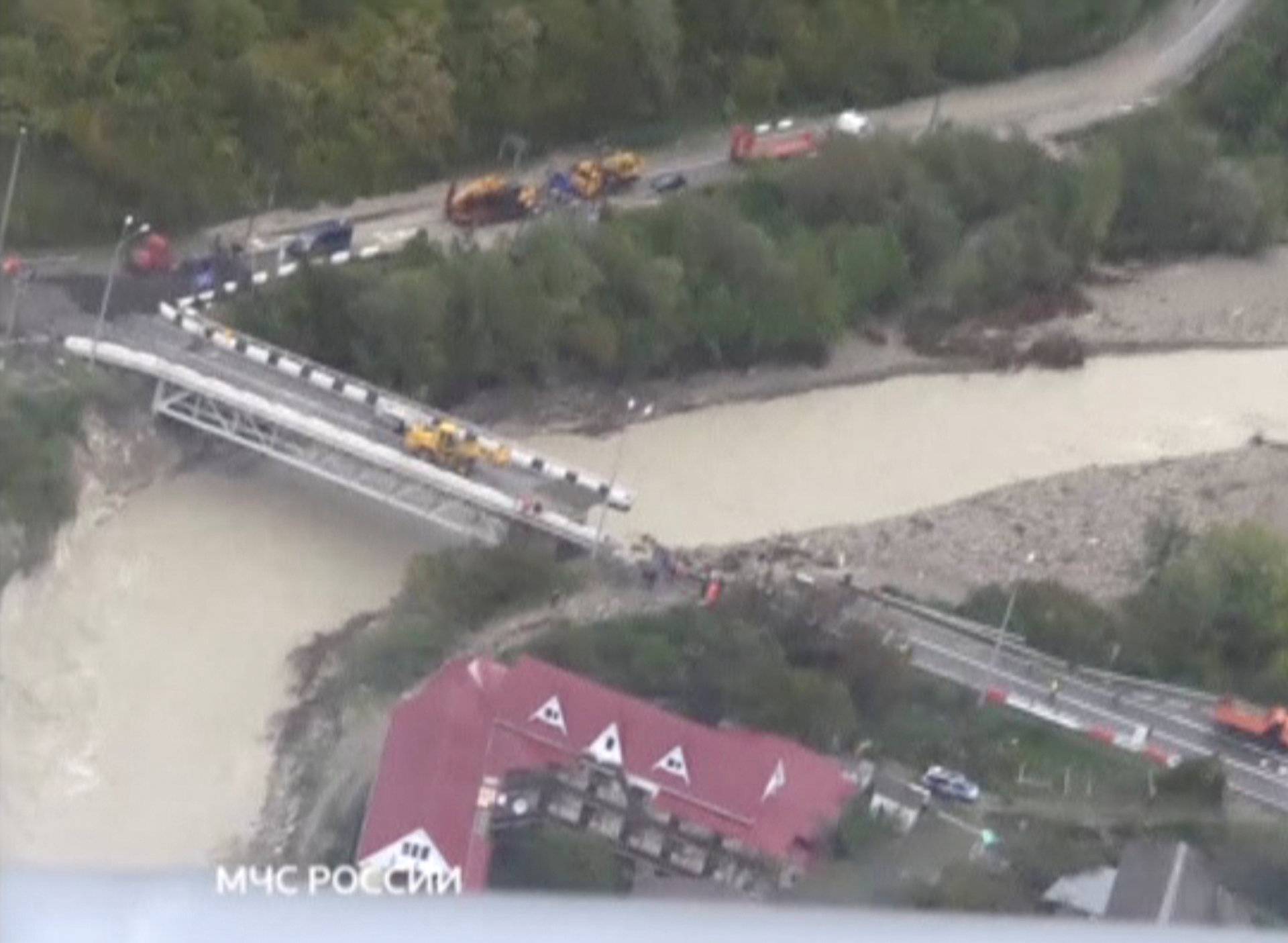 A still image shows a bridge damaged by floodwaters in a settlement in Krasnodar Region