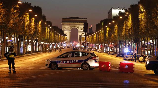 Police secure the Champs Elysee Avenue after one policeman was killed and another wounded in a shooting incident in Paris