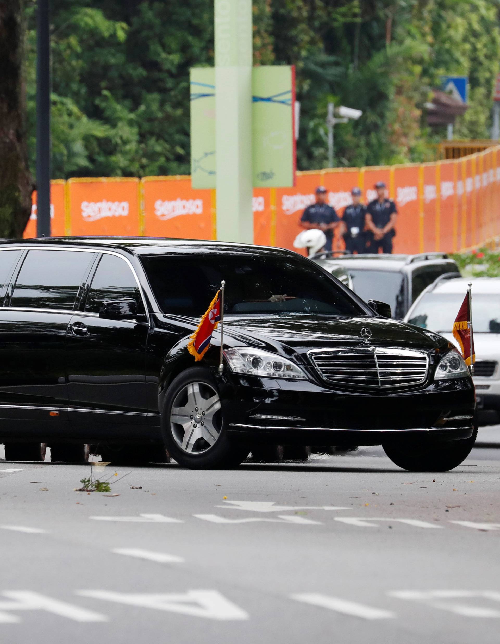 The motorcade of North Korea's leader Kim Jong Un arrives at the Capella hotel, the venue of the summit between North Korea and the U.S., on Sentosa island in Singapore