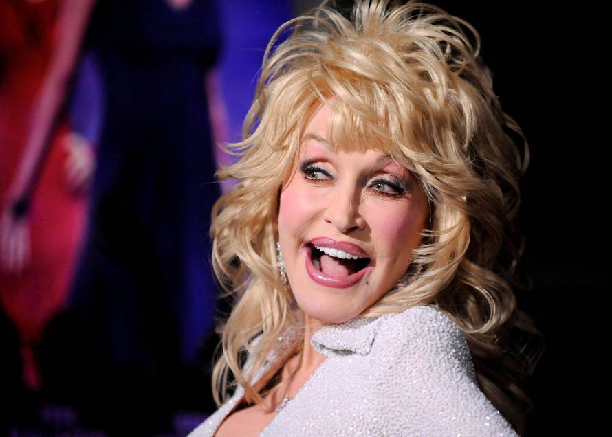 FILE PHOTO: Actress and singer Dolly Parton arrives at the Hollywood premiere of "Joyful Noise" in Los Angeles, California
