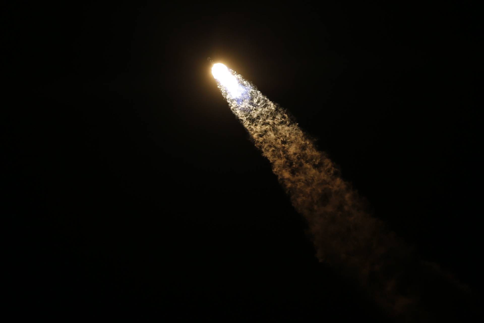 A SpaceX Falcon 9 rocket, with the Crew Dragon capsule carrying four astronauts on a NASA commercial crew mission, launches at the Kennedy Space Center