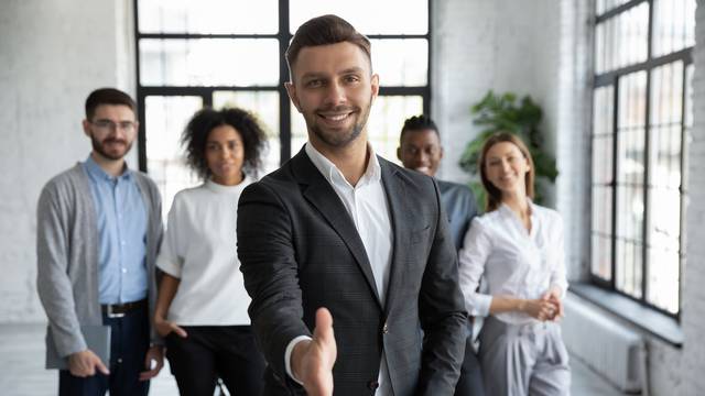 Head,Shot,Portrait,Confident,Smiling,Businessman,Offering,Hand,For,Handshake,