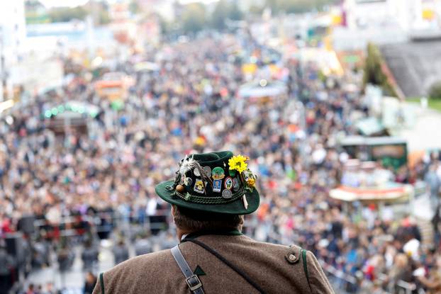 Traditionally dressed Bavarians arrive to shoot salute on the stairs of the Bavaria statue on the last day of the 187th Oktoberfest in Munich