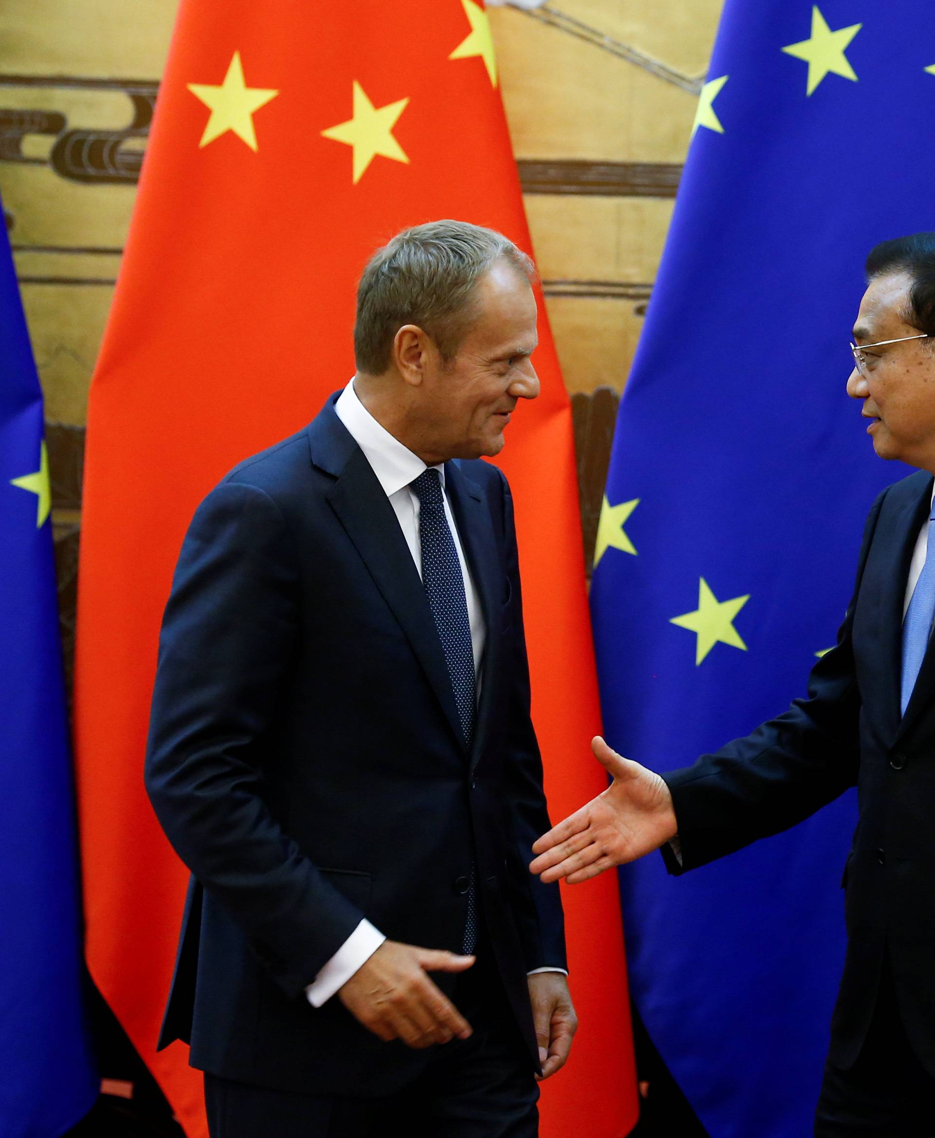 European Council President Donald Tusk, Chinese Premier Li Keqiang and European Commission President Jean-Claude Juncker attend signing ceremony at the Great Hall of the People in Beijing