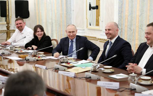 Russian President Vladimir Putin meets with war correspondents in Moscow