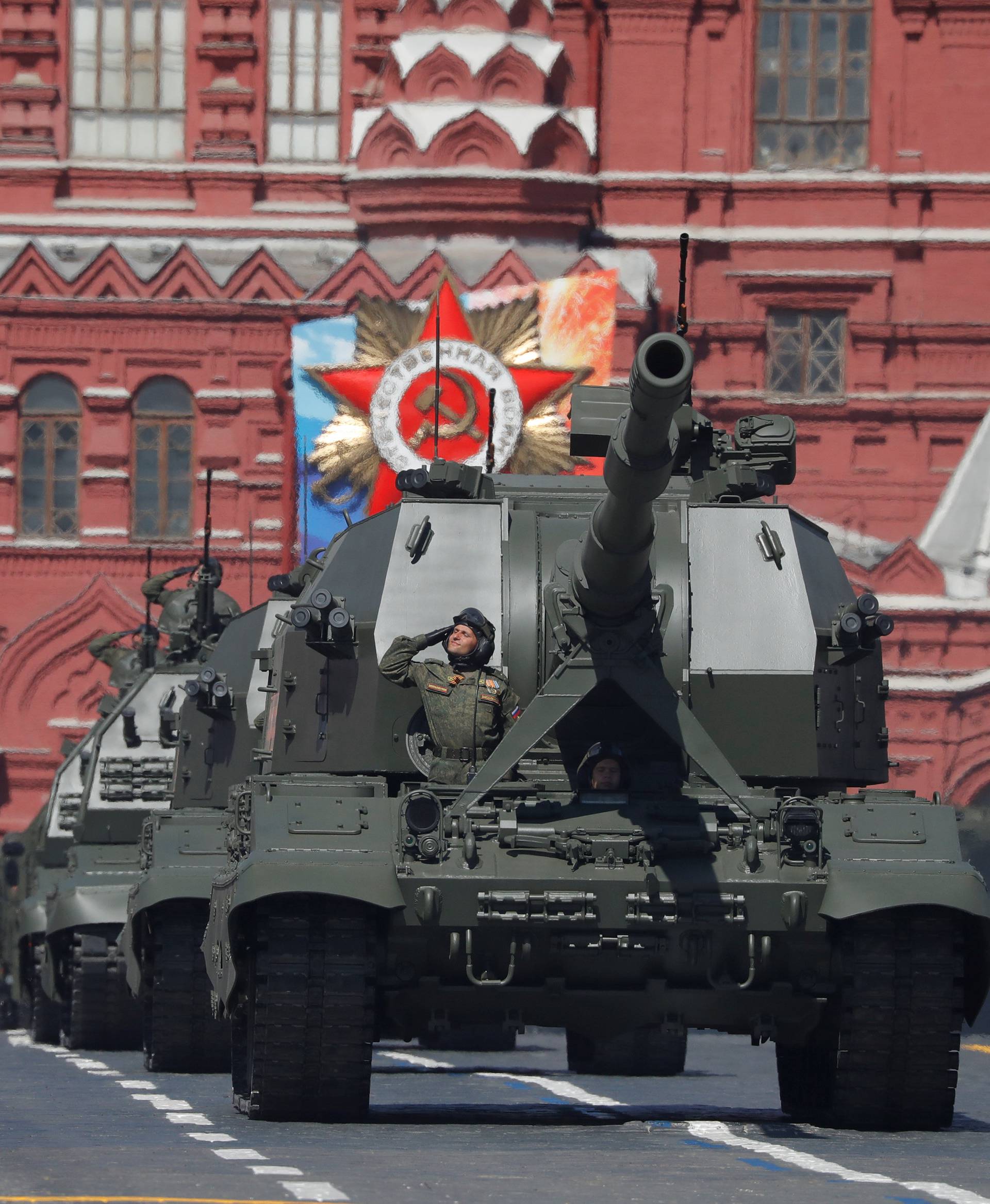 Russian servicemen drive military vehicles during the Victory Day parade at the Red Square in Moscow