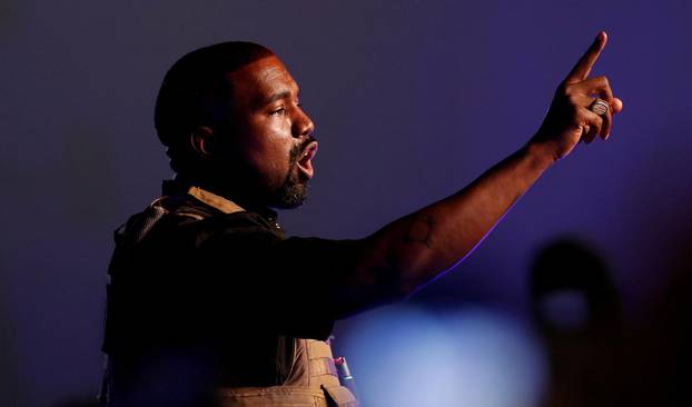 FILE PHOTO: Rapper Kanye West gestures to the crowd as he holds his first rally in support of his presidential bid in North Charleston