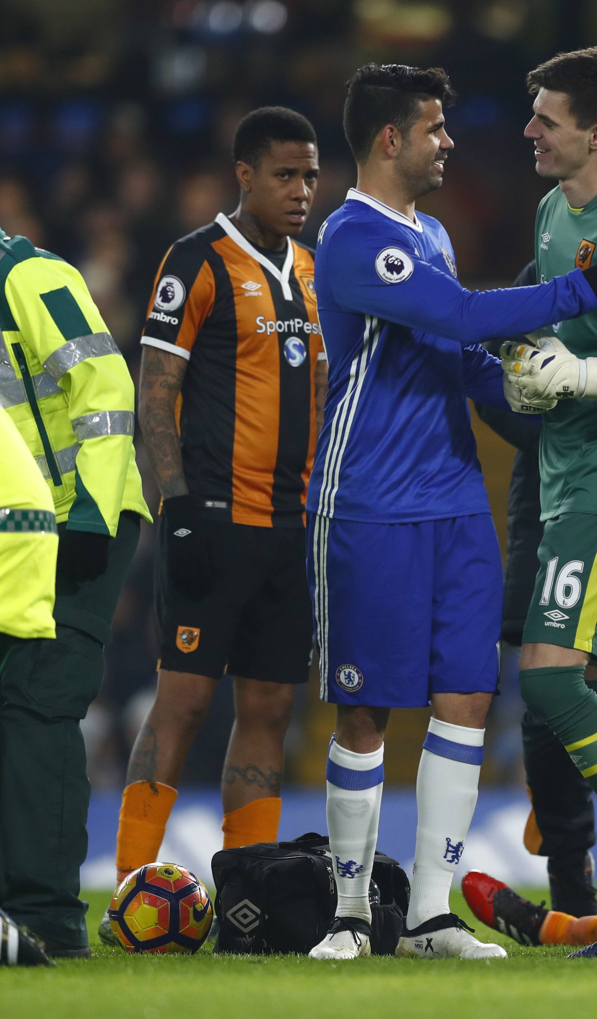 Chelsea's Diego Costa and Hull City's Eldin Jakupovic as Hull City's Ryan Mason lies injured