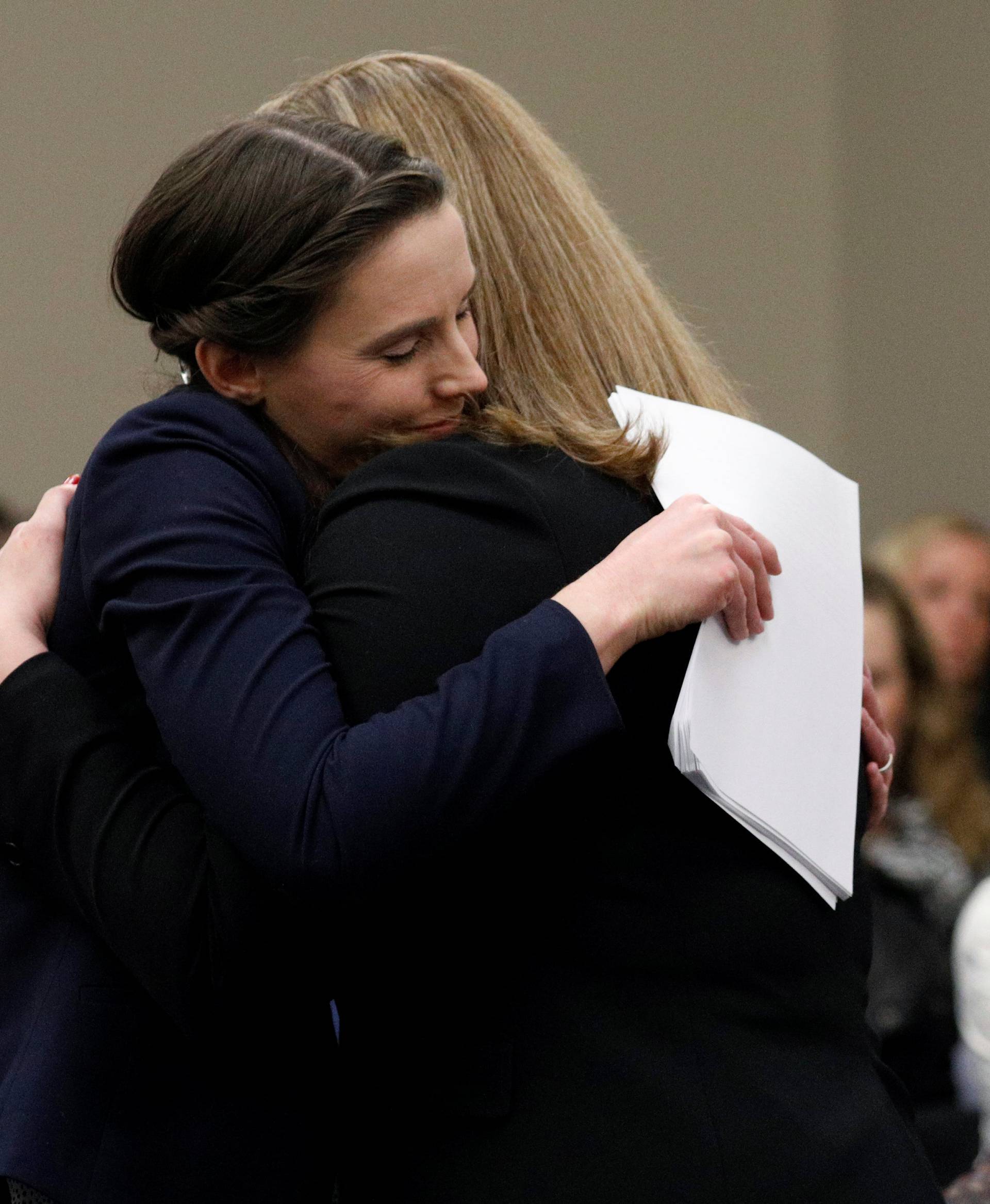 Victim Rachael Denhollander embraces prosecutor Angela Povilaitis at the sentencing hearing for Larry Nassar, a former team USA Gymnastics doctor who pleaded guilty in November 2017 to sexual assault charges, in Lansing