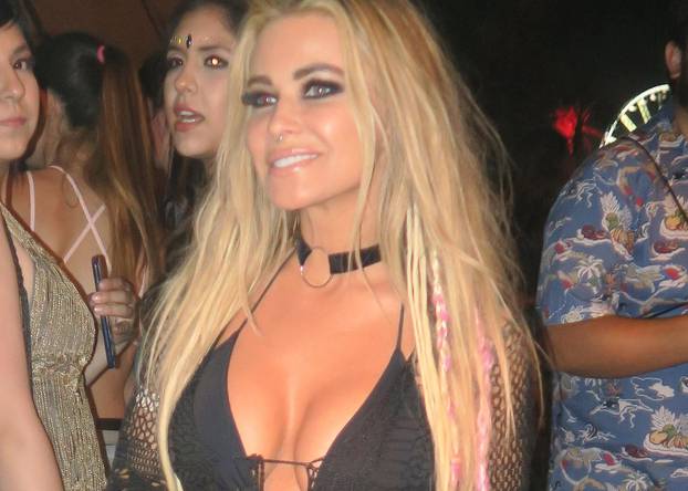Carmen Electra leaves little to the imagination in a sheer outfit at Coachella