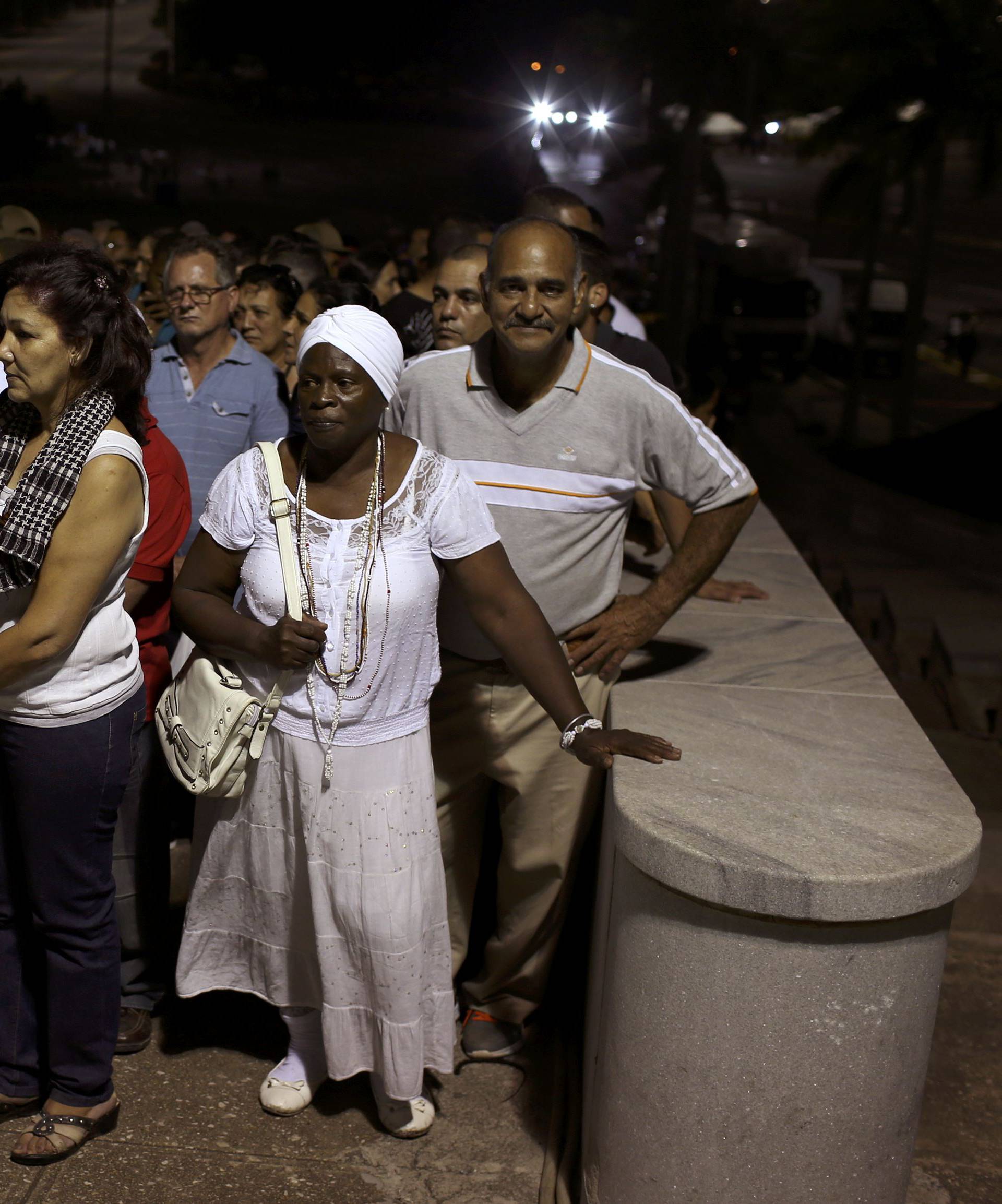 People wait in line to pay tribute to Cuba's late President Fidel Castro at the Jose Marti Memorial in Revolution Square in Havana