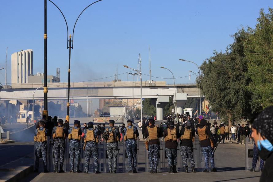 Supporters of Iraqi Shi'ite armed groups gather after the killing of Iran's Supreme Leader Ayatollah Ali Khamenei, in Baghdad