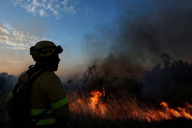 A wildfire burns on the outskirts of Valmojado