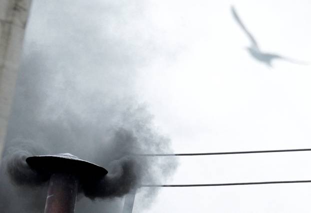 FILE PHOTO: Black smoke rises from the chimney on the Sistine Chapel in Saint Peter's Square at the Vatican
