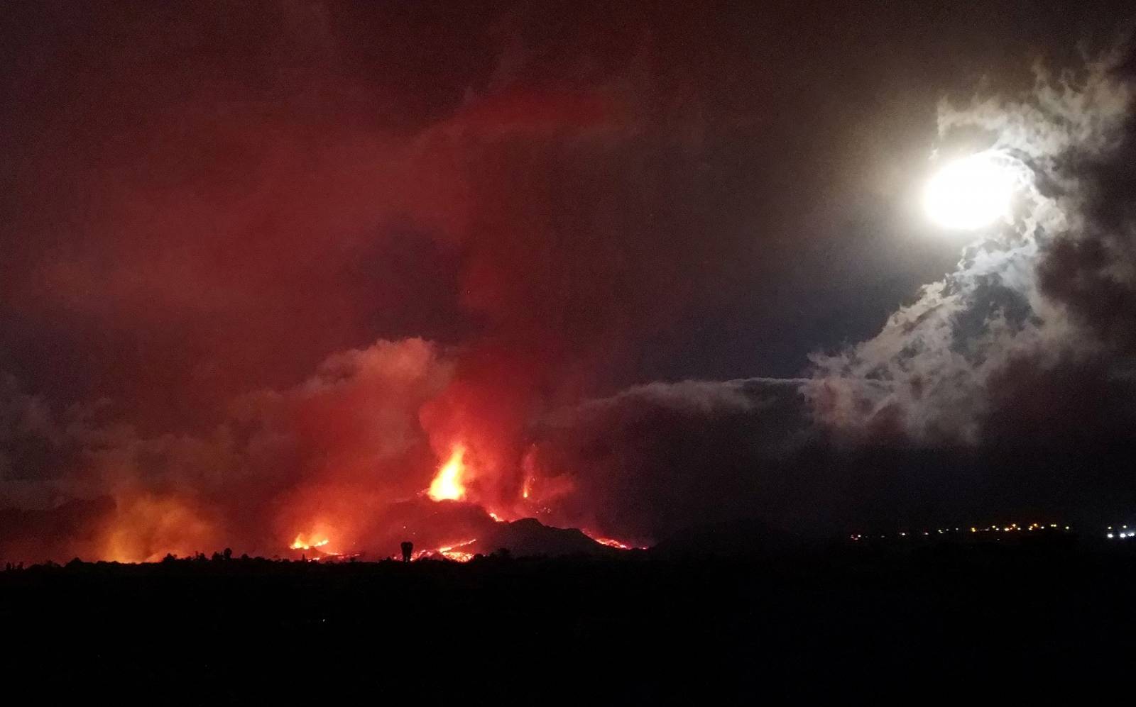 FILE PHOTO: Lava and smoke rise following the eruption of a volcano on the Island of La Palma