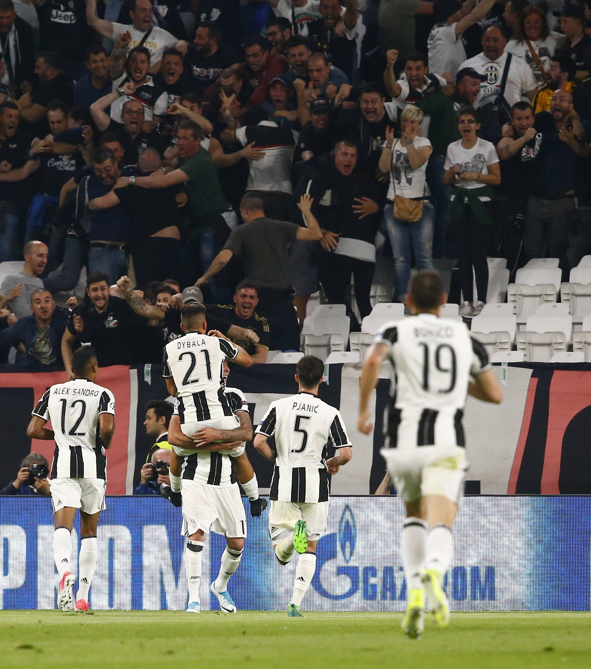 Juventus' Paulo Dybala celebrates scoring their second goal with team mates