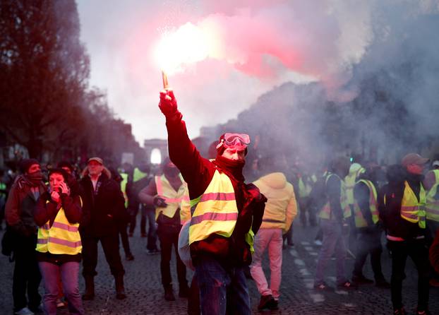 A protester wearing yellow vest, a symbol of a French drivers
