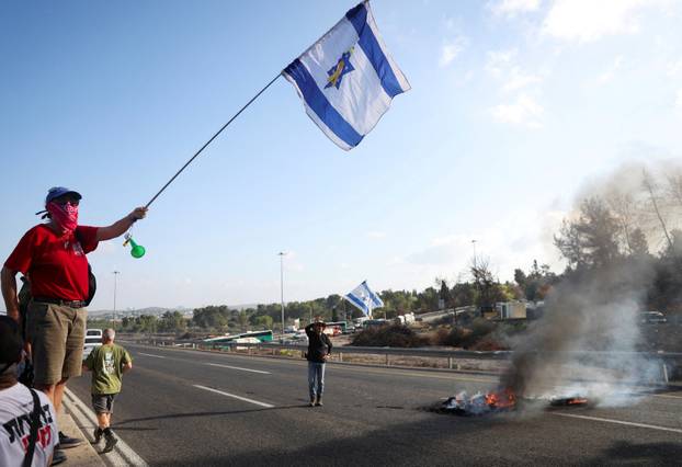People block Israel's main highway connecting Jerusalem and Tel Aviv near Latrun