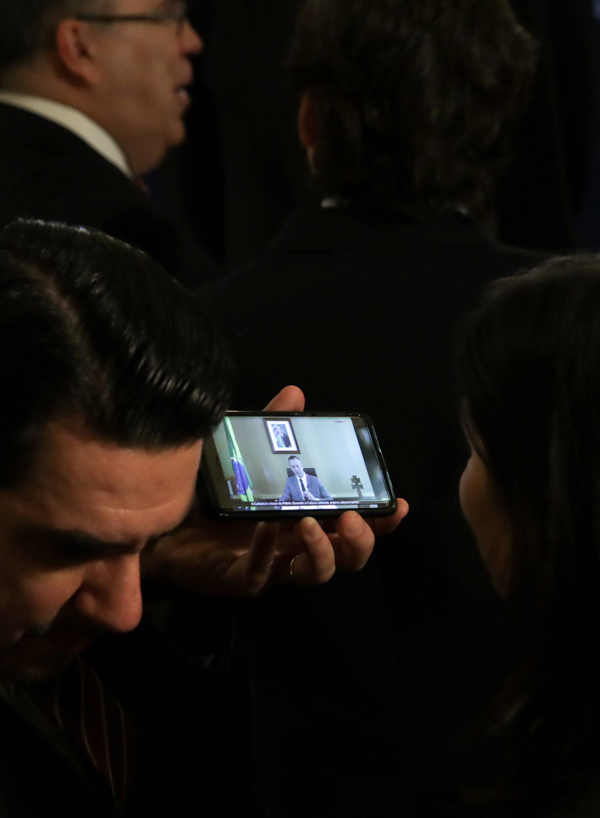 Diplomats watch a video of controversial remarks by Brazil's Culture Secretary Alvim as they gather at the Organization of American States for remarks by U.S. Secretary of State Pompeo at the OAS in Washington