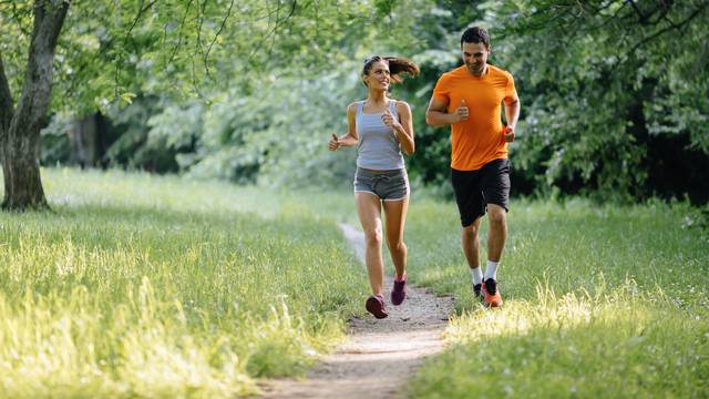 Couple,Jogging,And,Running,Outdoors,In,Nature