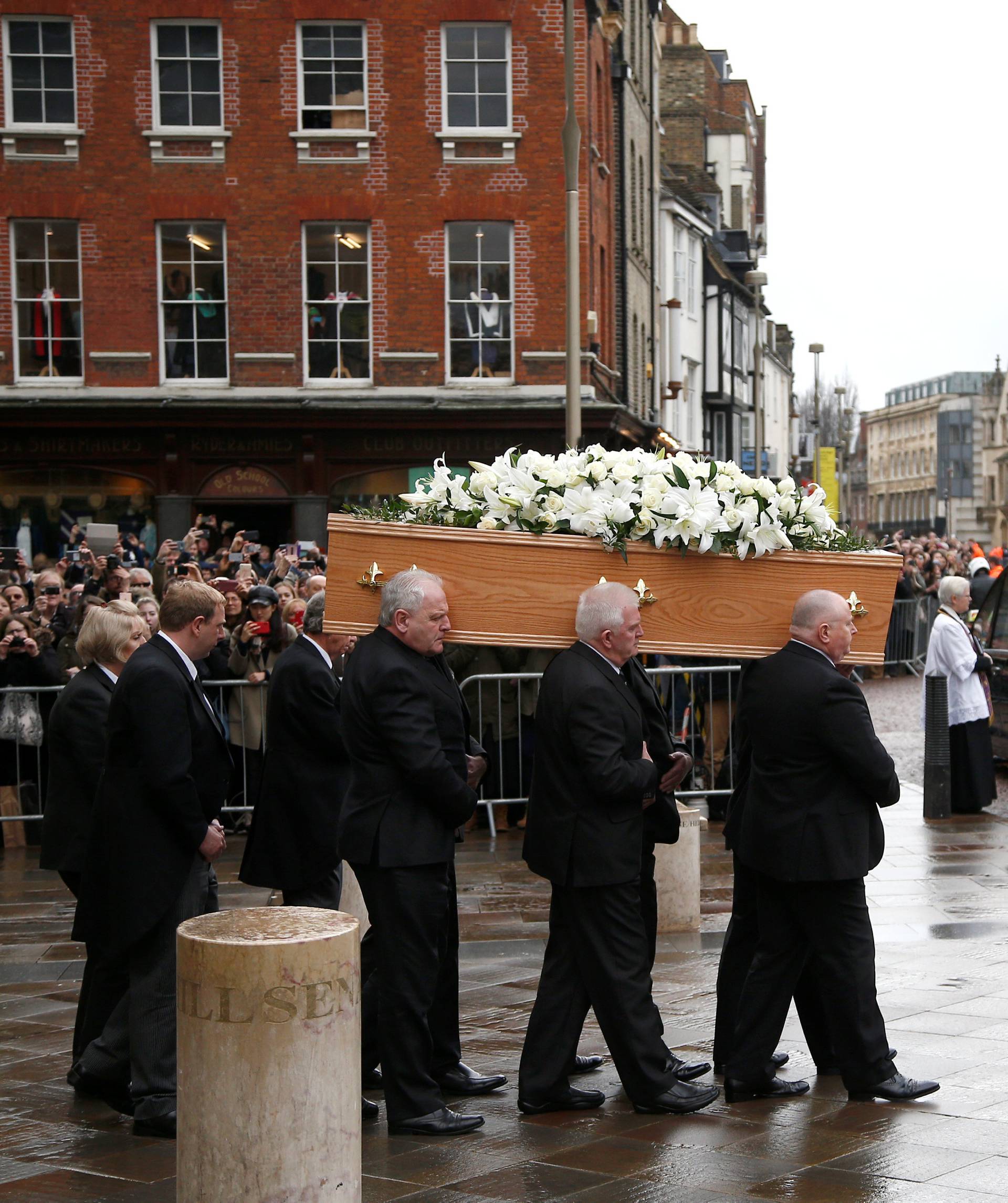 Pallbearers carry the coffin out of Great St Marys Church at the end of the funeral of theoretical physicist Prof Stephen Hawking, in Cambridge